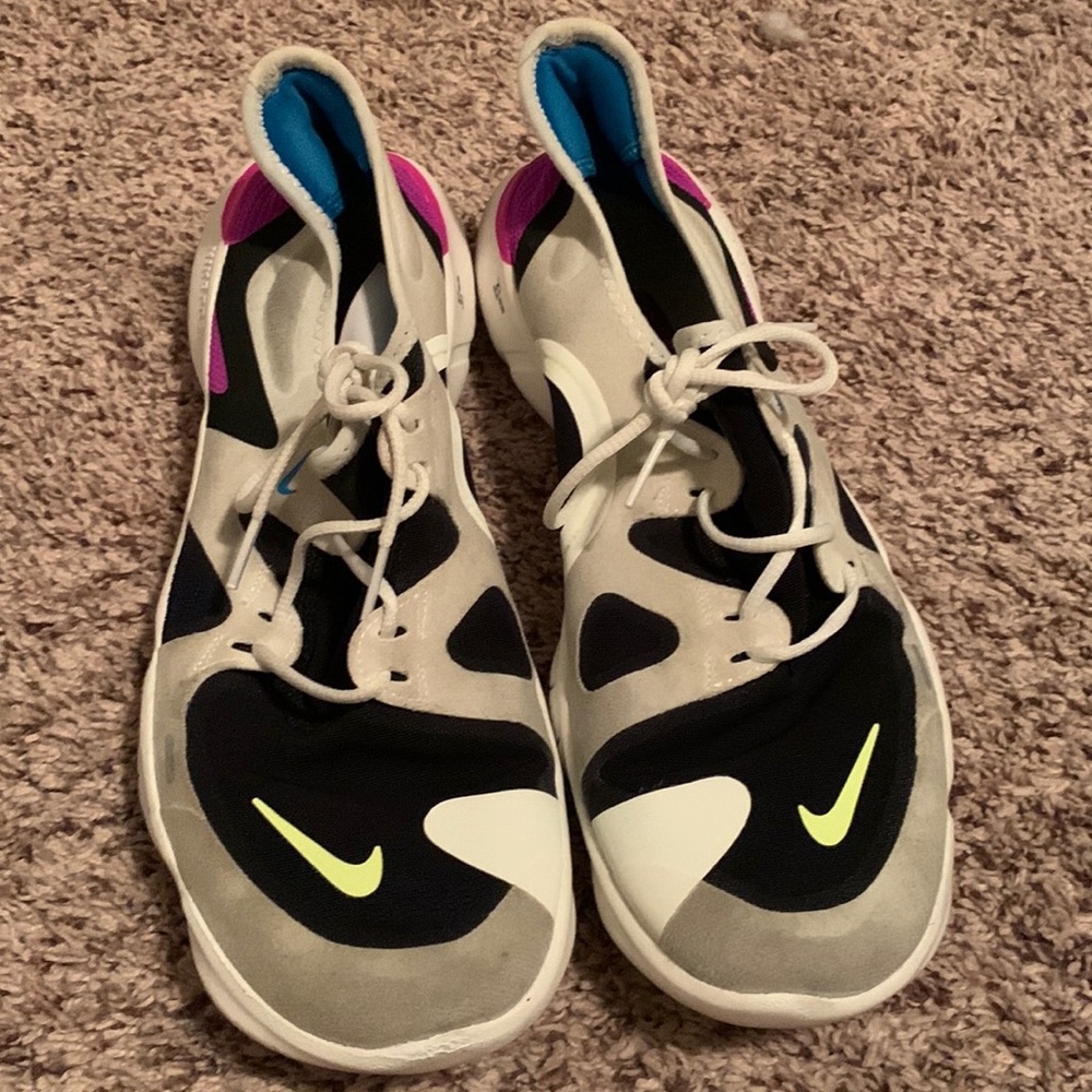Slightly worn white Nike shoes